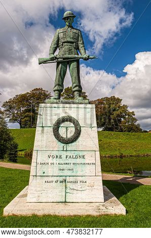 Copenhagen, Denmark - September 13, 2010: Frontal Closeup Of Vore Faltne Green Bronze Statue On Lime