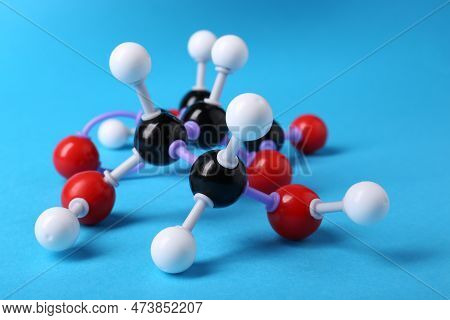 Molecule Of Vitamin C On Light Blue Background. Chemical Model