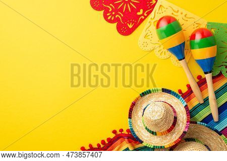 Cinco-de-mayo Concept. Top View Photo Of Traditional Headwear Sombrero Colorful Striped Serape Garla