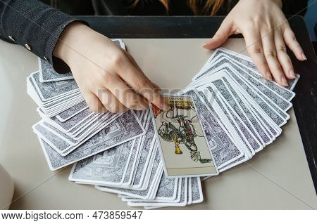 Tver, Russia - February 11, 2023. Tarot Cards, Tarot Card Divination, Esoteric Background. A Woman M