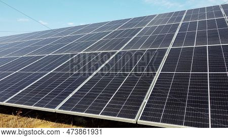 Solar Power Plant. Flight Over Modules Of Solar Power Station On Sunny Day. Alternative Green Electr
