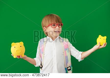 Happy Child Student Against Green Chalkboard