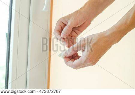 Man's Hands, Install Roller Blinds On The Window. Installation Of Roller Blinds