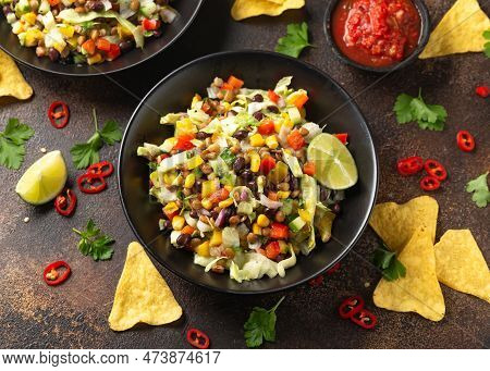 Mexican Style Salad Of Black Beans, Lentils, Corn, Tomato And Lettuce With A Salsa And Tortilla Chip