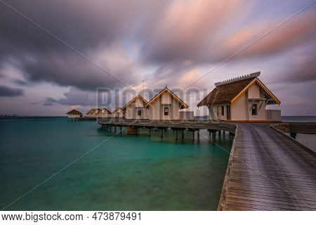 Island In Ocean, Overwater Villas At The Time Sunset. Crossroads Maldives, Saii Lagoon. Long Exposur