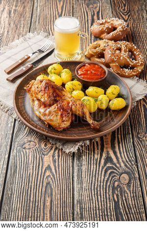Bavarian Roast Chicken Hendl With Boiled Potatoes Served With Beer And Pretzel Closeup On The Wooden