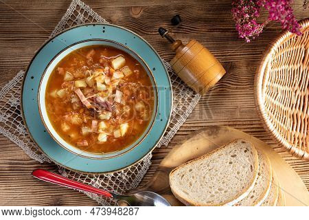 Traditional Cabbage Soup On Wooden Table. Selective Focus.