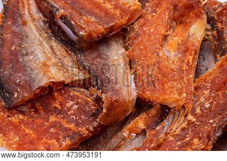Pieces Of Cleaned Dried Fishbackground. Dry Peppered Pollack. Amber With Pepper Collection.