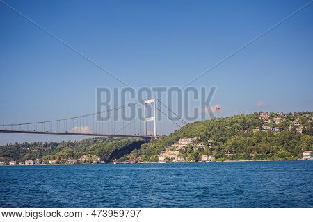 Turkey, Istanbul, Houses Below Fatih Sultan Mehmet Bridge On Bosphorus Strait