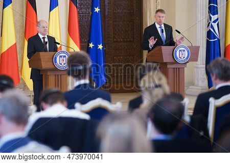 Bucharest, Romania. 3rd Apr, 2023: Olaf Scholz (l), Chancellor Of Germany, Listen To The Speech Of R