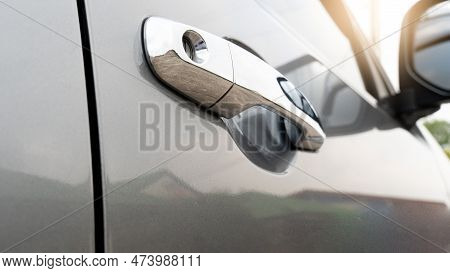 Close Of Open Chrome Door Of Gray Color. Parking At Outdoor In The Eveing Time.