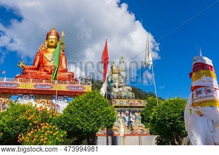 Wide Angle View Of Holy Statue Of Guru Padmasambhava Or Born From A Lotus, Guru Rinpoche, Blue Sky A