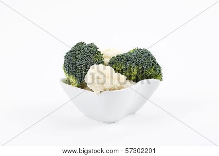 Broccoli and cauliflower in a porcelain bowl