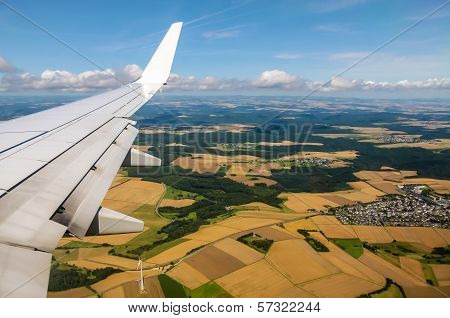 Aerial View Of Plane Wing And Fields