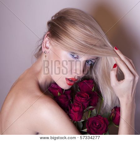 Beautiful Woman With Red Roses.