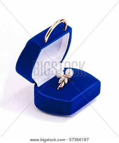 gold ring with pearls in blue velvet gift box