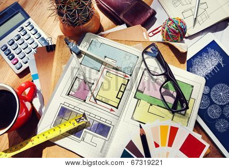 Messy Designer's Table with Project Plan and Tools