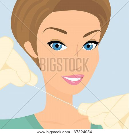 Friendly female dentist demonstrates floss