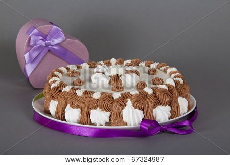 Gateau on dish and a souvenir