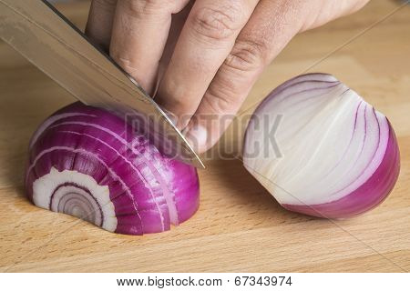 Chef Choppig A Red Onion With A Knife