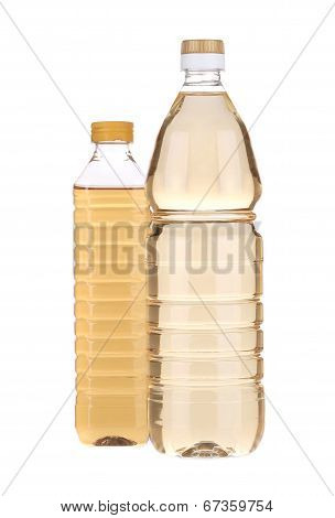 two bottles with apple vinegar