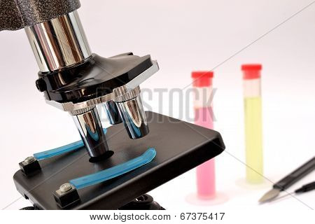 microscope and test tubes isolated on white background