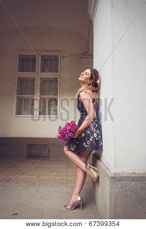 Fashionable Woman Wearing A Blue Floral Print Dress, Gold Shoes