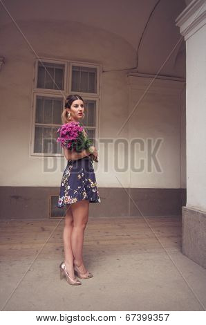 Fashionable Woman Wearing A Blue Floral Print Dress, Gold Shoes