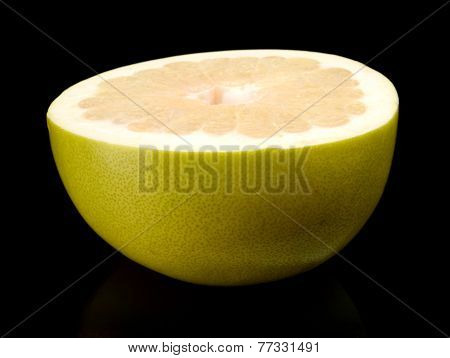 Half Of Pomelo, Chinese Grapefruit Isolated On Black