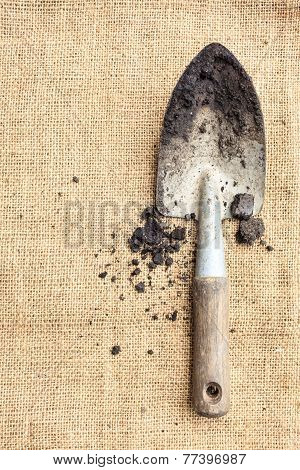 Gardening tools soil on nature background