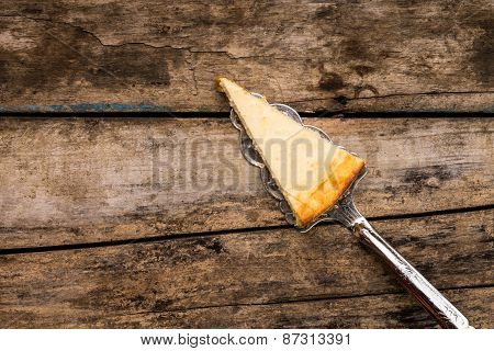 Slice Of New York Cheesecake On Cake Server