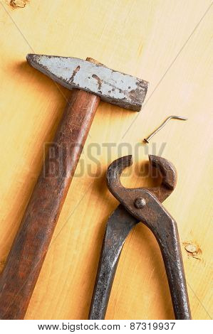 Old Rusty Tools On Wooden Board