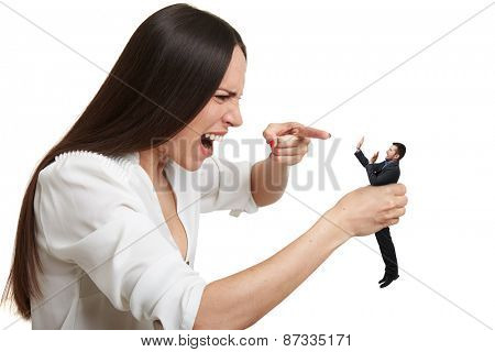emotional yelling woman pointing at small scared man over white background