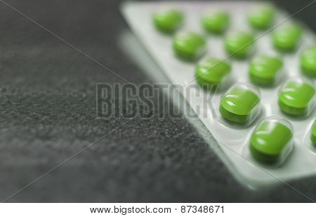 Blister pack of Green medicine pills Close up