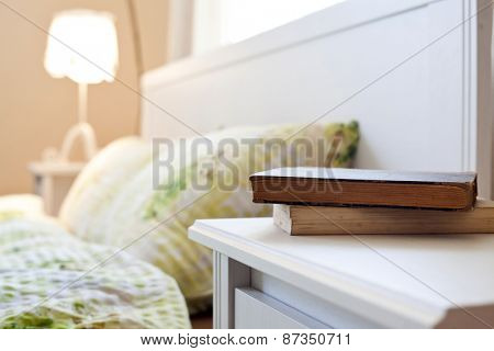 bedroom with books on nightstand