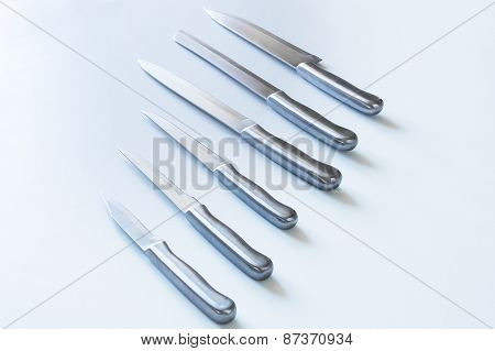 Set of steel kitchen knives, isolated
