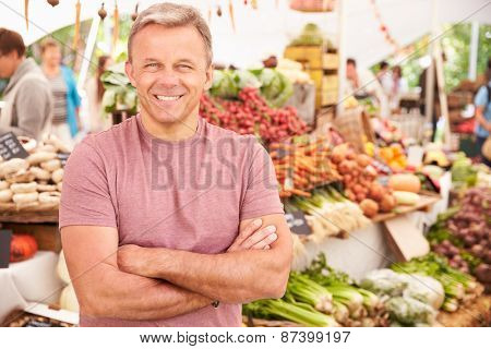 Male Stall Holder At Farmers Fresh Food Market