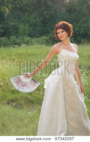Young beautiful girl in a wedding dress