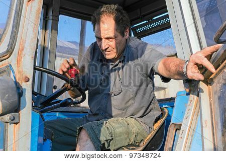 man on tractor