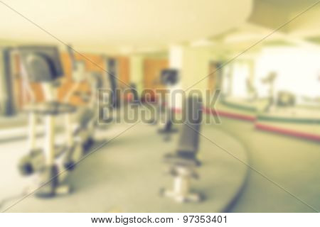 Abstract blur Fitness center with traineger equipments  ( Filtered image processed vintage effect. )