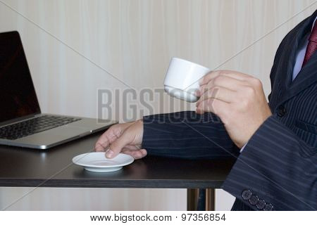 a cup of coffee in the workplace in the office top view