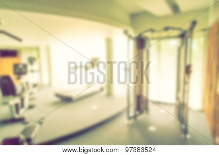 Abstract blur Fitness center with traineger equipments  ( Filtered image processed vintage effect. )
