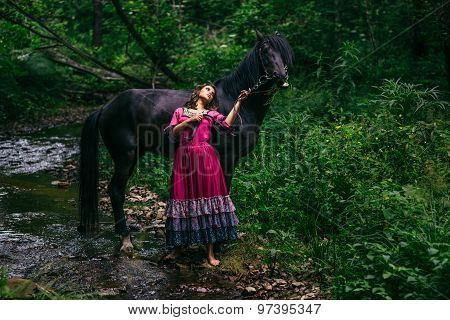Beautiful gypsy in violet dress