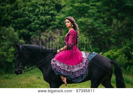 Beautiful woman on a horse