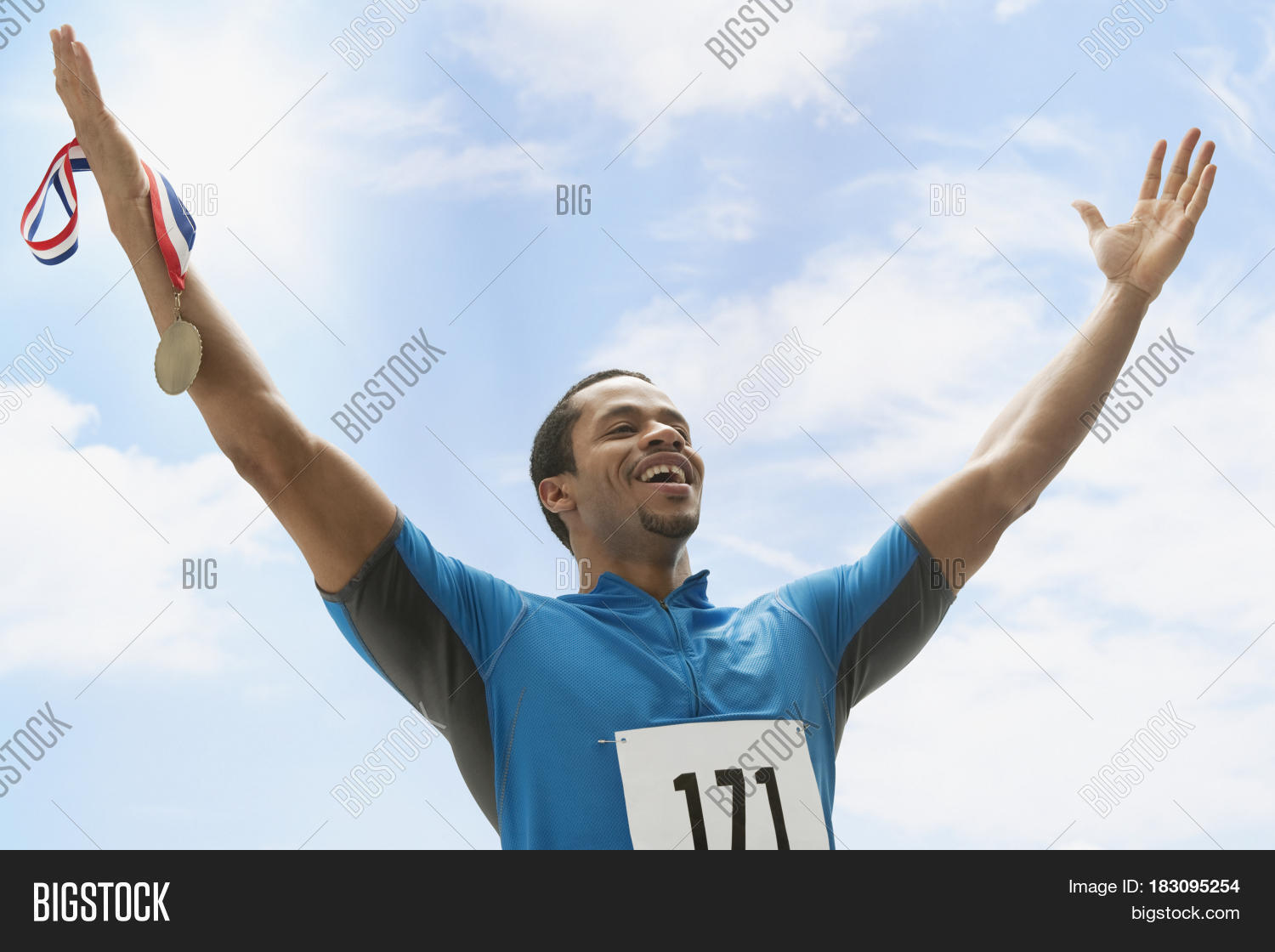 Mixed Race Athlete Holding Medal Image & Photo Bigstock