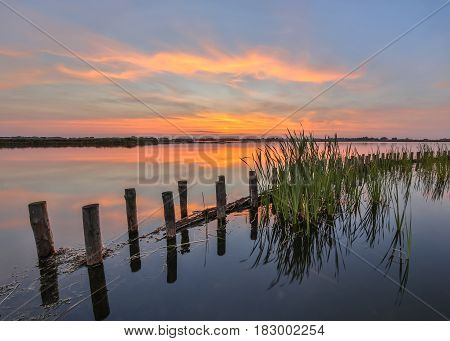 Sunset Over Lake With Bank Protection