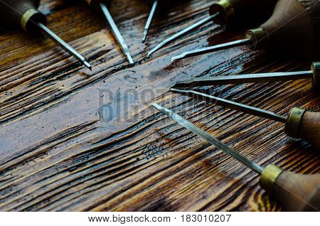 Different Gravers For Jewelry On Wooden Background