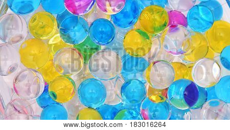 transparent colored water balls texture close up