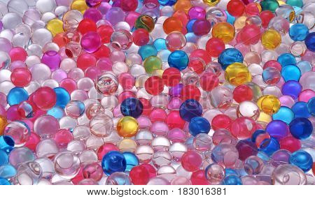 transparent colored water balls texture close up