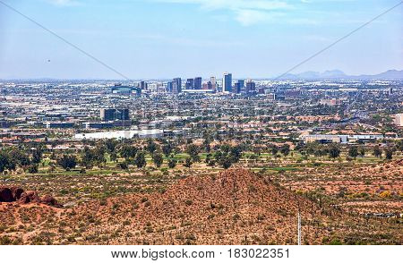 Aerial view of the downtown Phoenix Arizona skyline from above Papago Park